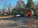 Carport with small tractor and Mazda Miata at 4126 Oxford School Rd, Catawba, NC 28609