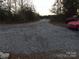 Gravel driveway leading to a house; cars parked on either side at 4126 Oxford School Rd, Catawba, NC 28609