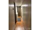 Long hallway with wood flooring and laundry hookups at 4126 Oxford School Rd, Catawba, NC 28609