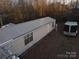 Mobile home with metal roof and a trailer in the yard at 4126 Oxford School Rd, Catawba, NC 28609