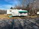 Fifth-wheel trailer parked on gravel driveway at 4126 Oxford School Rd, Catawba, NC 28609