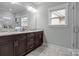 Double vanity bathroom with granite countertops and shower at 423 Solomon St, Charlotte, NC 28216