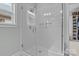 Walk-in shower with white tile, glass enclosure, and built-in seat at 423 Solomon St, Charlotte, NC 28216