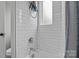 Clean bathroom with white subway tile, bathtub, and window at 423 Solomon St, Charlotte, NC 28216