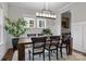 Elegant dining room featuring a large wooden table and built-in wine storage at 423 Solomon St, Charlotte, NC 28216