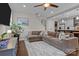 Open living room showcasing a sectional sofa and kitchen view at 423 Solomon St, Charlotte, NC 28216