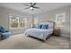 Spacious main bedroom with large bed, sitting area, and windows at 423 Solomon St, Charlotte, NC 28216