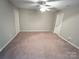 Spacious carpeted bedroom with neutral walls and ceiling fan at 435 Battery Cir, Clover, SC 29710