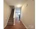 Bright entryway with hardwood floors and staircase at 435 Battery Cir, Clover, SC 29710