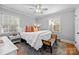 Comfortable bedroom with a king-size bed, rug, and ceiling fan at 4419 Halstead Dr, Charlotte, NC 28209