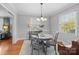 Spacious dining area with hardwood floors and access to living room at 4419 Halstead Dr, Charlotte, NC 28209