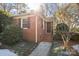 Brick home exterior with snowy walkway and landscaping at 4419 Halstead Dr, Charlotte, NC 28209