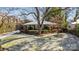 Charming brick home with snow-covered lawn at 4419 Halstead Dr, Charlotte, NC 28209