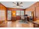 Bright home office features wood paneled walls, hardwood floors, and built-in shelving at 4419 Halstead Dr, Charlotte, NC 28209