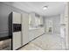 Efficient kitchen featuring white cabinets, dishwasher, and access to backyard at 4419 Halstead Dr, Charlotte, NC 28209