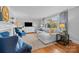 Light-filled living room with sectional sofa and large window at 4419 Halstead Dr, Charlotte, NC 28209