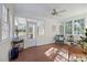 Bright sunroom featuring terracotta flooring, multiple windows, and access to backyard at 4419 Halstead Dr, Charlotte, NC 28209