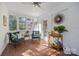 Relaxing sunroom with terracotta tile flooring, ceiling fan, and ample natural light at 4419 Halstead Dr, Charlotte, NC 28209