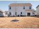 Home's backyard, featuring a patio and grill at 450 Caleb St, Monroe, NC 28110