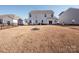 Home's backyard, showcasing the home's exterior and landscaping at 450 Caleb St, Monroe, NC 28110