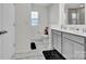 Modern bathroom with double vanity, large mirror, and marble floors at 450 Caleb St, Monroe, NC 28110