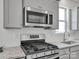 Stainless steel appliances and granite countertops in this modern kitchen at 450 Caleb St, Monroe, NC 28110