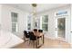 Chic dining area with a wooden table, four chairs, and a modern light fixture at 5048 York Park Ln, Charlotte, NC 28217