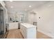 Well-lit kitchen with island, stainless steel appliances, and stylish pendant lighting at 5048 York Park Ln, Charlotte, NC 28217