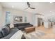 Open concept living room flowing into a kitchen with white cabinets and stainless steel appliances at 5048 York Park Ln, Charlotte, NC 28217