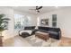 Cozy living room with a dark grey sectional sofa and bright natural light at 5048 York Park Ln, Charlotte, NC 28217