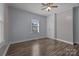 Bedroom with hardwood floors, ceiling fan, and ample closet space at 535 5Th St, Chester, SC 29706