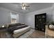 Cozy bedroom features a plush bed, stylish shelving, and soft lighting for a relaxing ambiance at 535 5Th St, Chester, SC 29706