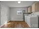 Bright laundry room with a window and modern washer and dryer at 535 5Th St, Chester, SC 29706