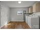 Laundry room complete with washer, dryer, and cabinets at 535 5Th St, Chester, SC 29706