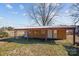 Outbuilding with windows and a covered porch in the backyard at 535 5Th St, Chester, SC 29706