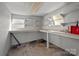 Workshop with shelves and two windows for plenty of natural light at 535 5Th St, Chester, SC 29706