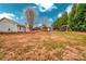 Large backyard with shed, swing set, and privacy trees at 5704 Bentgrass Ct, Monroe, NC 28110