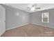 Simple bedroom with neutral walls and carpeted floor at 5704 Bentgrass Ct, Monroe, NC 28110