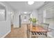 Bright dining room with wood table and chairs, open to kitchen at 5704 Bentgrass Ct, Monroe, NC 28110