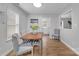 Dining area with wood table, gray chairs, and access to kitchen at 5704 Bentgrass Ct, Monroe, NC 28110