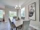 Bright dining room with gray chairs and art at 574 Altamonte Dr, Clover, SC 29710