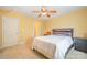 Bedroom with ceiling fan and window with sheer curtains at 6057 Erie View Ct, Denver, NC 28037