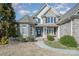 Brick front of house with welcoming porch and landscaping at 6057 Erie View Ct, Denver, NC 28037