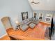 Spacious living room with hardwood floors, L-shaped sofa, and vaulted ceiling at 6057 Erie View Ct, Denver, NC 28037