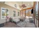 Relaxing screened porch with wicker furniture and a TV at 6057 Erie View Ct, Denver, NC 28037