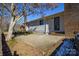 Backyard with patio, brick chimney and mature trees at 6615 Love Mill Rd, Monroe, NC 28110