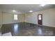 Unfinished basement with concrete floors and exterior access at 6615 Love Mill Rd, Monroe, NC 28110