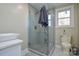 Updated bathroom with a glass shower and modern fixtures at 6615 Love Mill Rd, Monroe, NC 28110