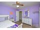 Spacious bedroom with light purple walls and a white dresser at 6615 Love Mill Rd, Monroe, NC 28110