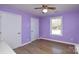 Bedroom featuring neutral color walls with window, and white doors, adding a touch of elegance to the space at 6615 Love Mill Rd, Monroe, NC 28110